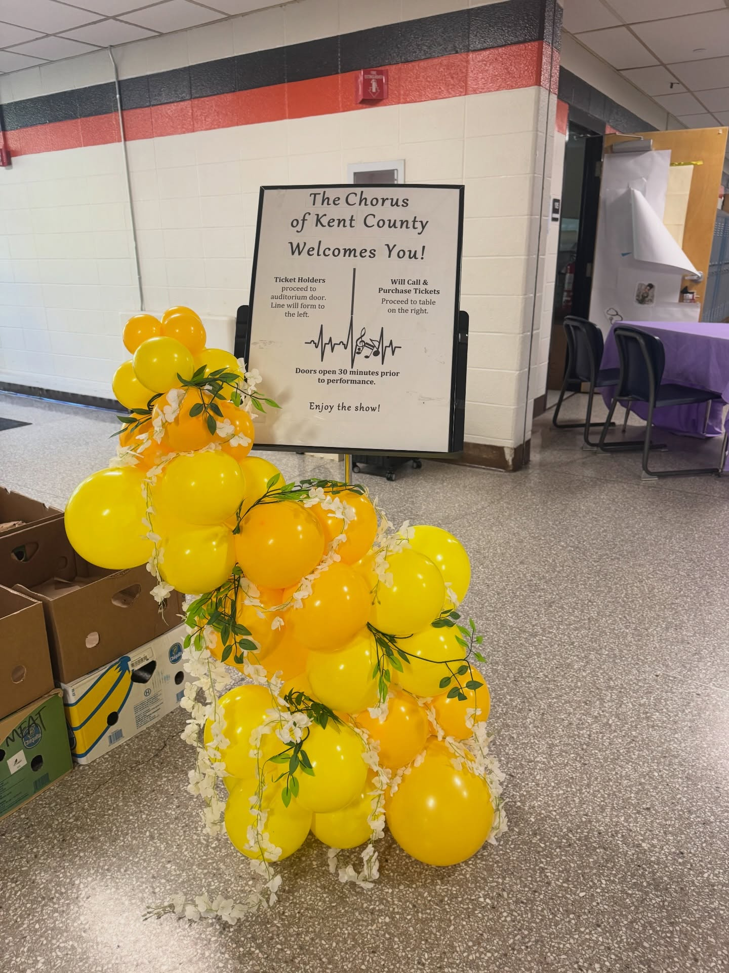 Yellow balloon garland with floral accents