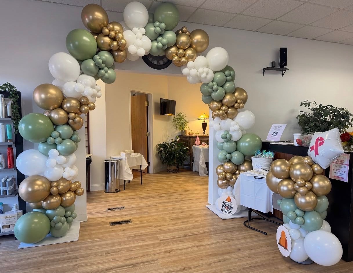 Sage green, white and gold balloon arch entryway